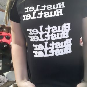 A tee that says hustler